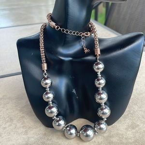 Rose gold tone necklace with 11 shiny silver balls 8 inch long when closed/20 cm